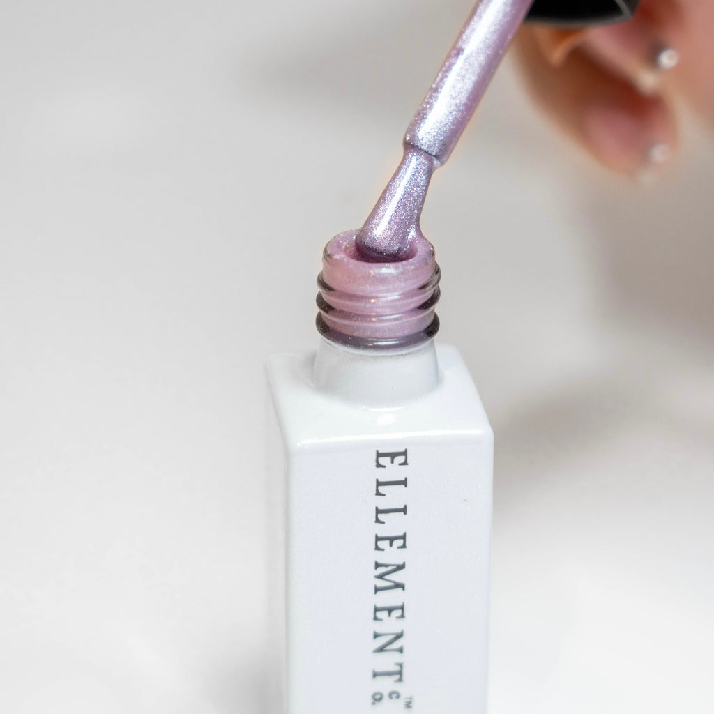 Femme Cat Eye Gel Polish in purplish pink with berry hint showing magnetic effect.